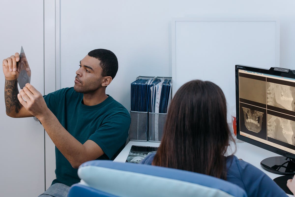 A Man Looking at an X-Ray Image