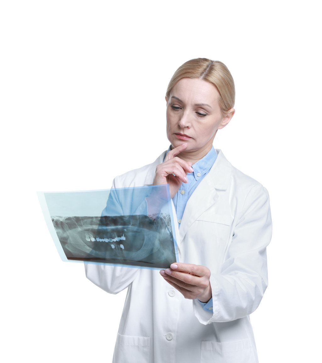 Traumatic Dental Injuries in Allentown, PA 1 Doctor examining x-ray image on white background